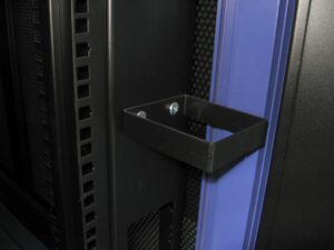Close up of Cable Management (Located at Front) are located vertically on the front and back of the cabinet used to maintaint neat and tidy arrangement of cable routing within the cabinet. 